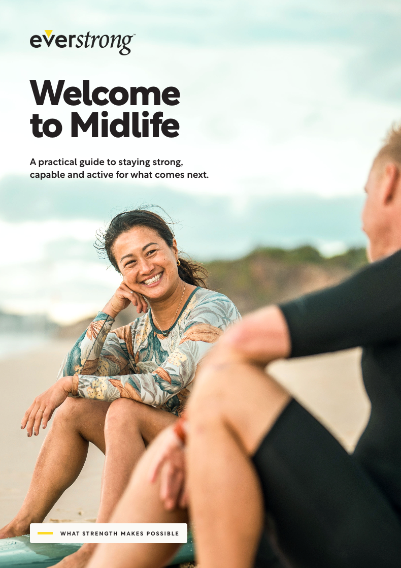 Cover of the Welcome to Midlife guide: a woman smiling on the beach beside a friend